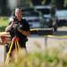 A Washtenaw County Sheriff Deputy surveys an area on Greenlawn Ave. on Wednesday, August 21, 2013. Melanie Maxwell | AnnArbor.com